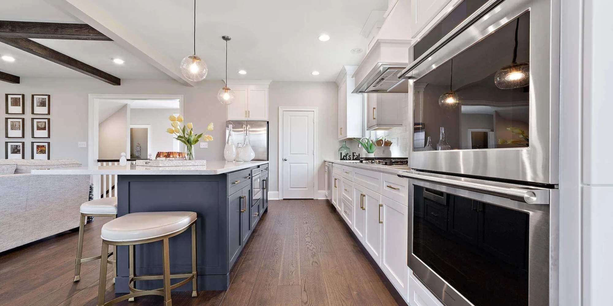 Custom kitchen interior in West Chester home by Thompson Communities featuring dark island