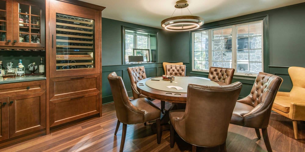 Elegant poker room with leather chairs and custom round table in Chester County, PA