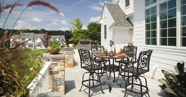 On the patio of a custom home in West Chester, PA by Thompson Communities