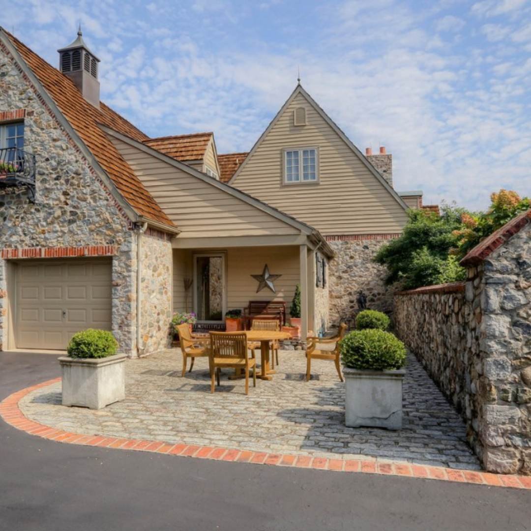 A custom home with stone features by Thompson Communities Custom Homes and Renovations