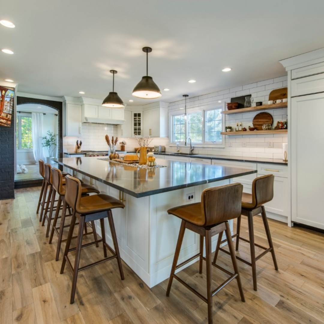 Spacious kitchen remodel with a large island in Avalon by Thompson Communities