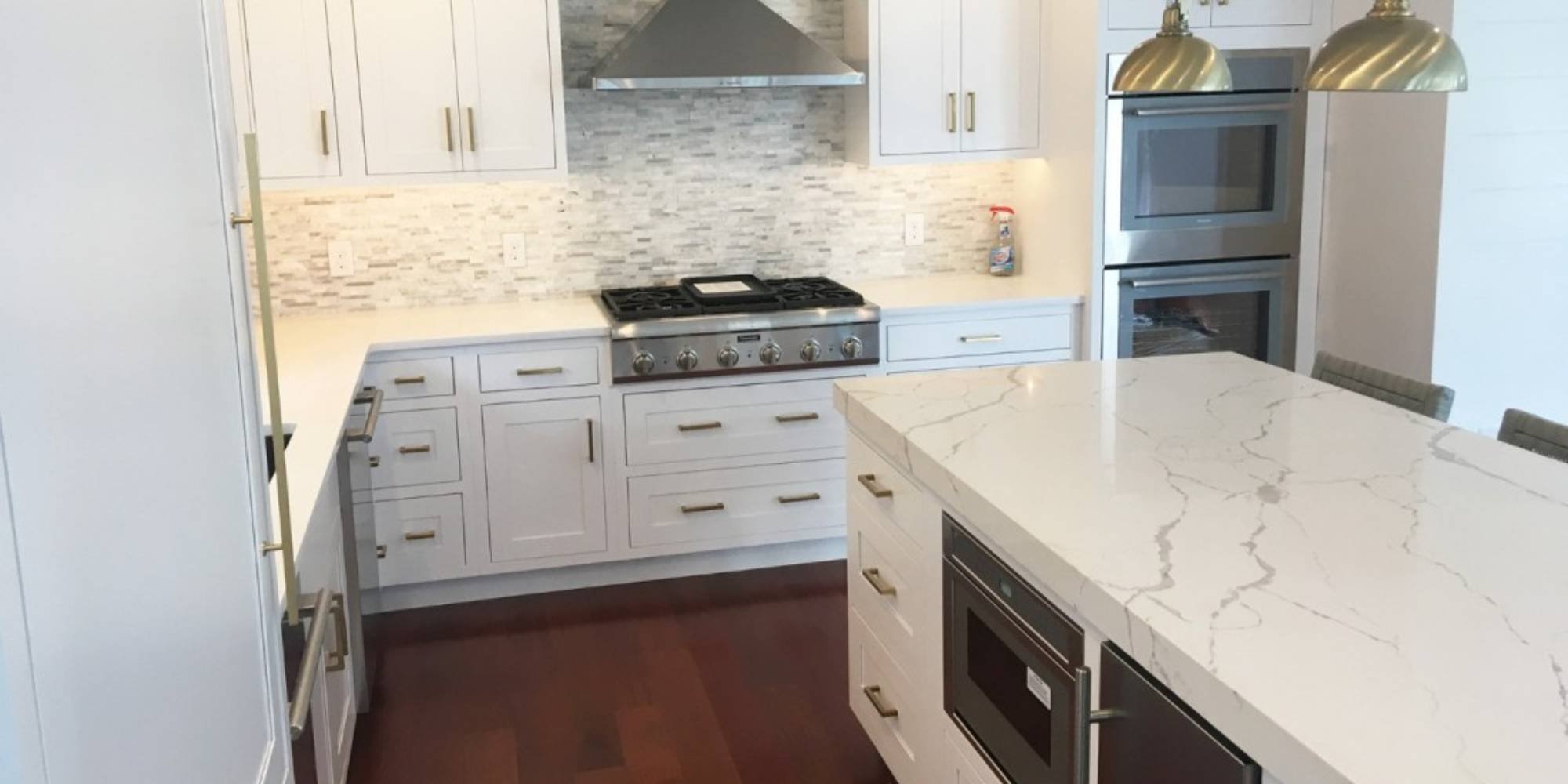 Kitchen island with appliance accessories by Thompson Communities Custom Homes