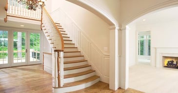 Image of a grand staircase and open entryway in a West Chester, PA home addition by Thompson Communities