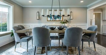 Image of a remodeled dining room area with overhead lighting by Thompson Communities