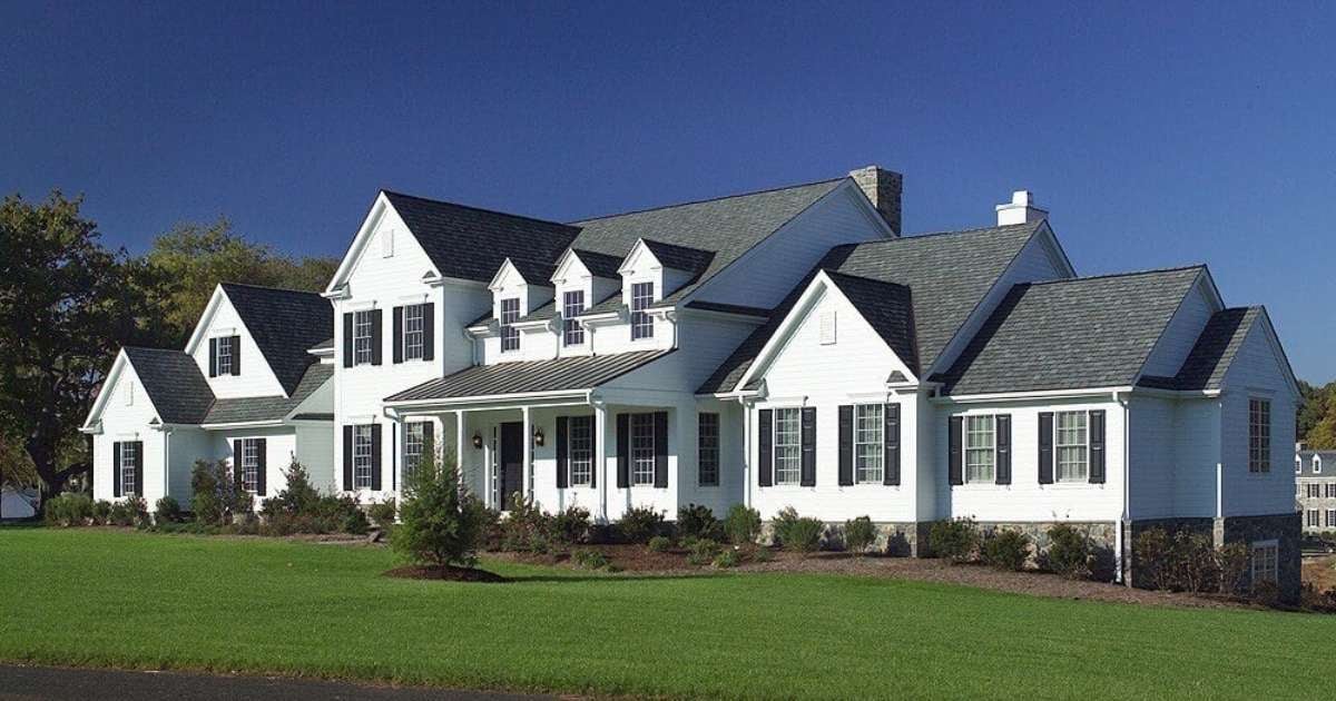 Spacious white custom home by Thompson Communities in West Chester, PA, featuring gabled roofing
