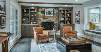 Living room with stone fireplace in a home addition by Thompson Communities in West Chester, PA