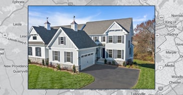 Thompson Communities custom home in Chester County, PA featuring farmhouse exterior, gables, and stone accents