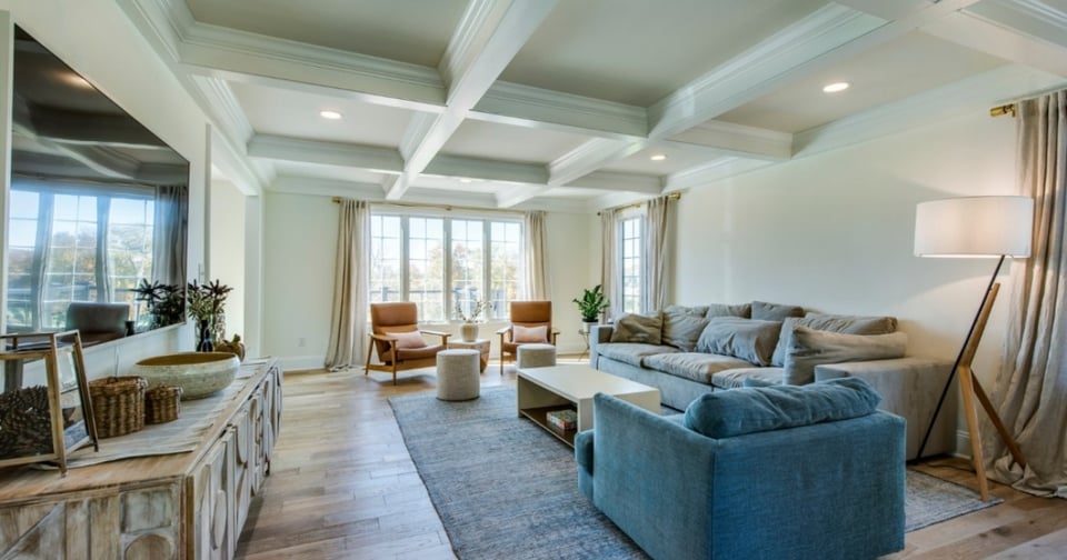 Spacious home addition by Thompson Communities featuring large windows and modern style