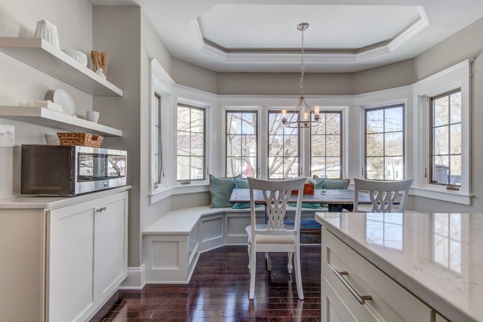 Breakfast nook with bay windows in a West Chester, PA home addition by Thompson Communities -  home additions costs 2025