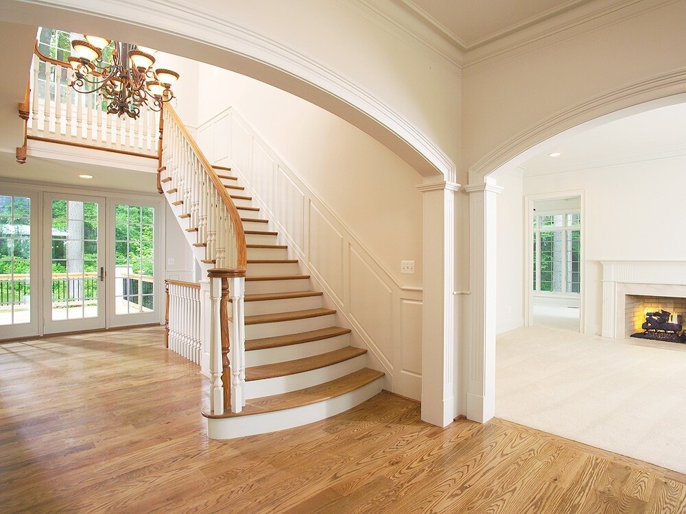 Grand staircase and open entryway in a West Chester, PA home addition by Thompson Communities