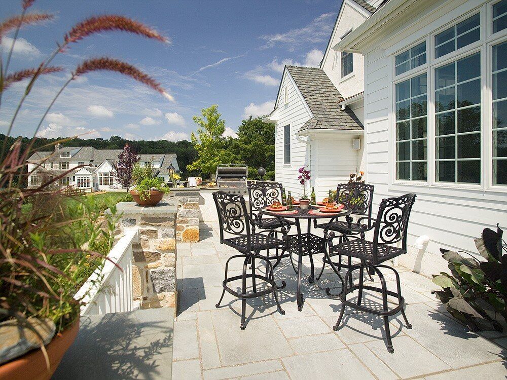 Custom-built outdoor patio with dining set -Luxury Home Addition Process - Thompson Communities - Chester County Builder and Remodeler 