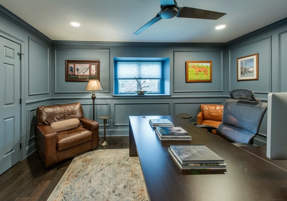 Stylish home office with leather chairs in a West Chester, PA home addition by Thompson Communities - Luxury Home Addition Process & Timeline