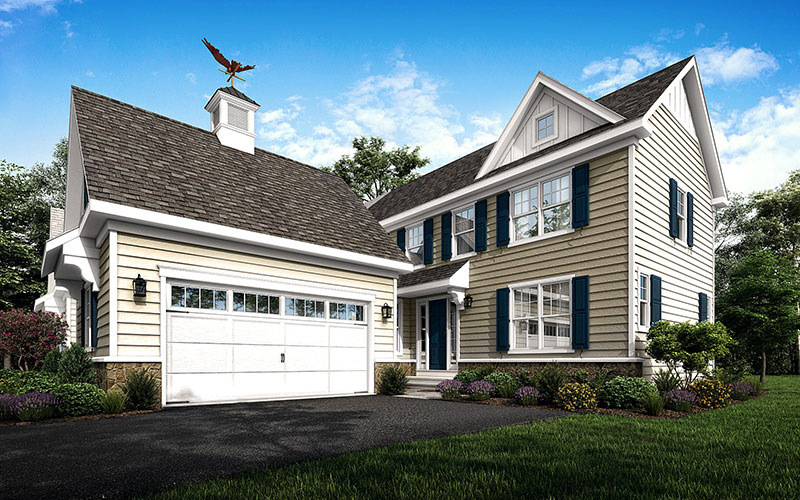 West Chester, PA custom home by Thompson Communities with elegant beige exterior and a spacious driveway