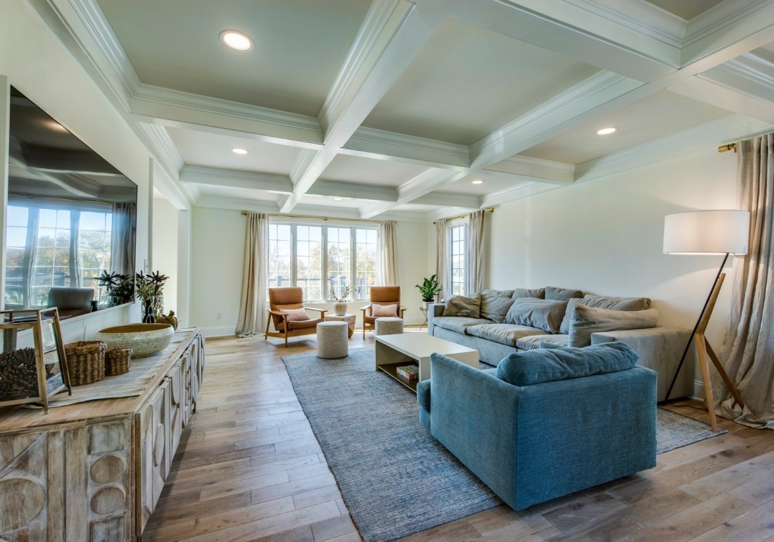 Open-concept living room with coffered ceiling in a custom home by Thompson Communities, West Chester, PA