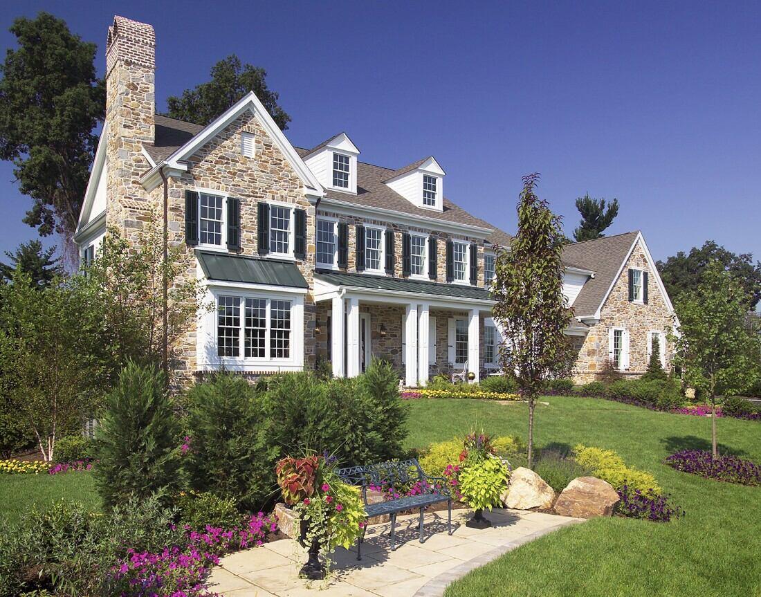 Outdoor patio with wrought-iron furniture at a custom home by Thompson Communities in West Chester, PA