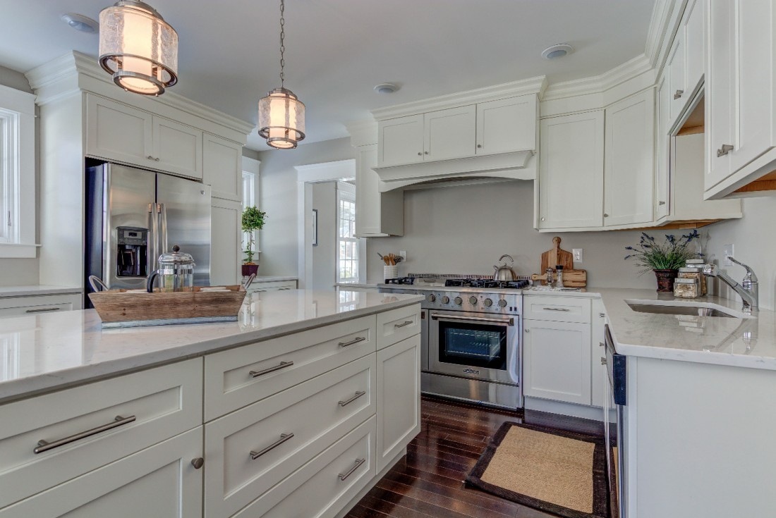Classic kitchen remodel with soft white cabinets and pendant lighting by Thompson Communities in West Chester, PA