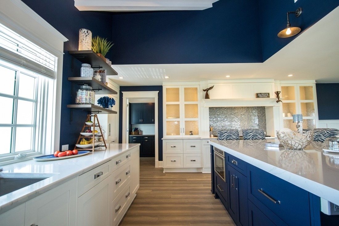 Modern navy and white kitchen with open shelves and large island- Kitchen Remodel Process & Timeline - Thompson Communities - Chester County Builder and Remodeler