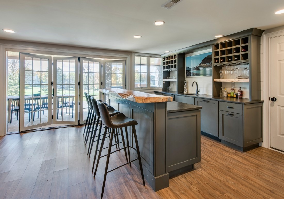 Elegant home bar remodel by Thompson Communities in West Chester, PA, featuring a live-edge countertop