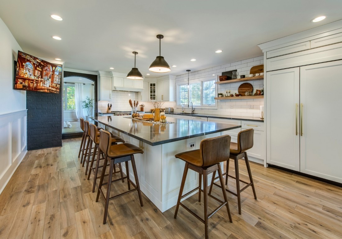 Spacious modern kitchen with a large island and barstool seating by Thompson Communities in West Chester, PA