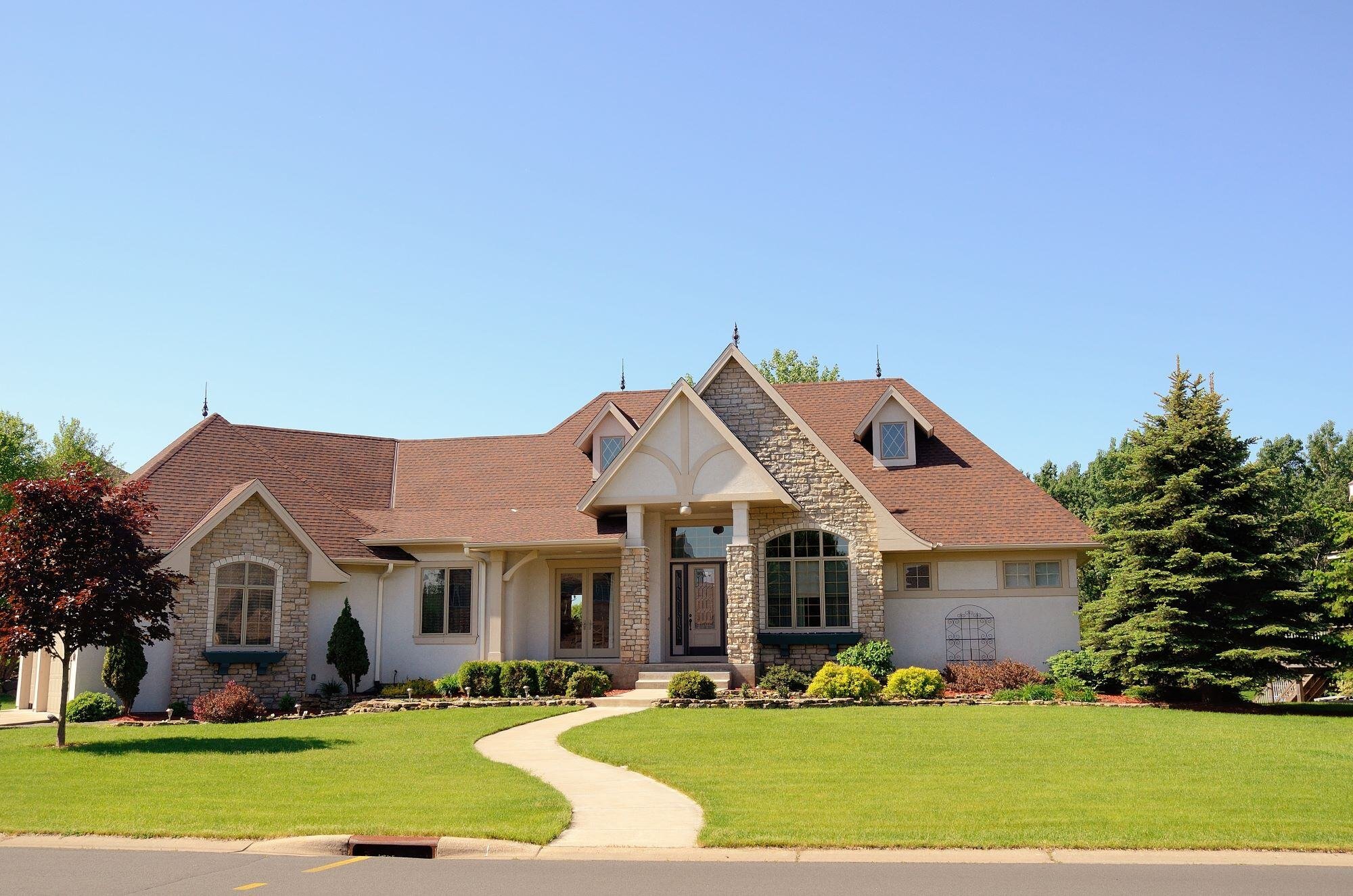 Worker applying stucco during a home renovation project by Thompson Communities in West Chester, PA
