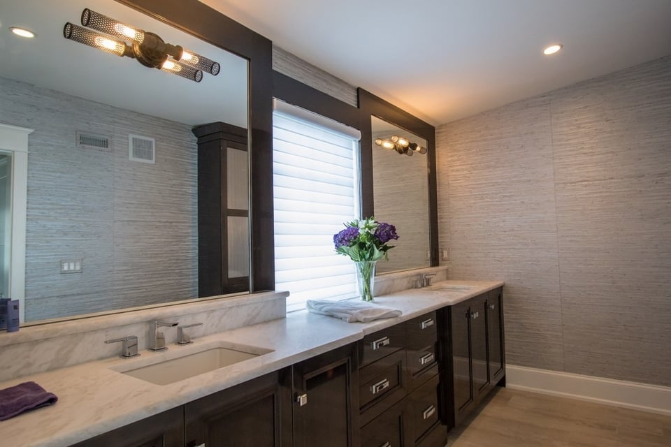 Elegant bathroom vanity with marble countertops in a whole home remodel by Thompson Communities, West Chester, PA - How Much Does It Cost to Remodel a Bathroom in the Tri-State Area