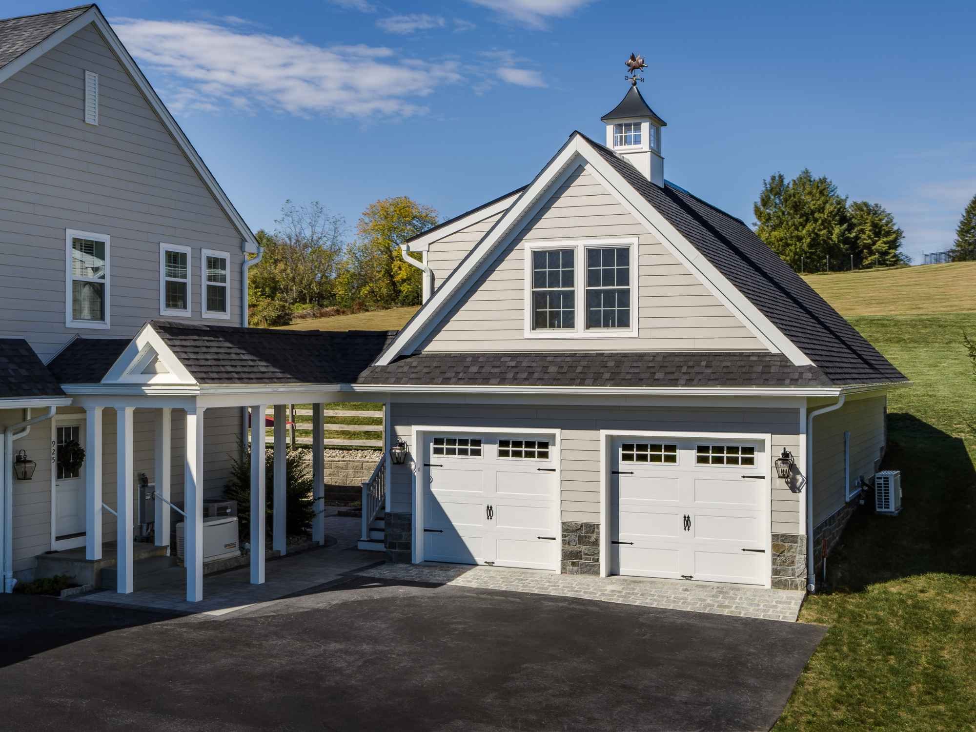An image of a two-story garage addition built to match the homes design in West Chester by Thompson Communities