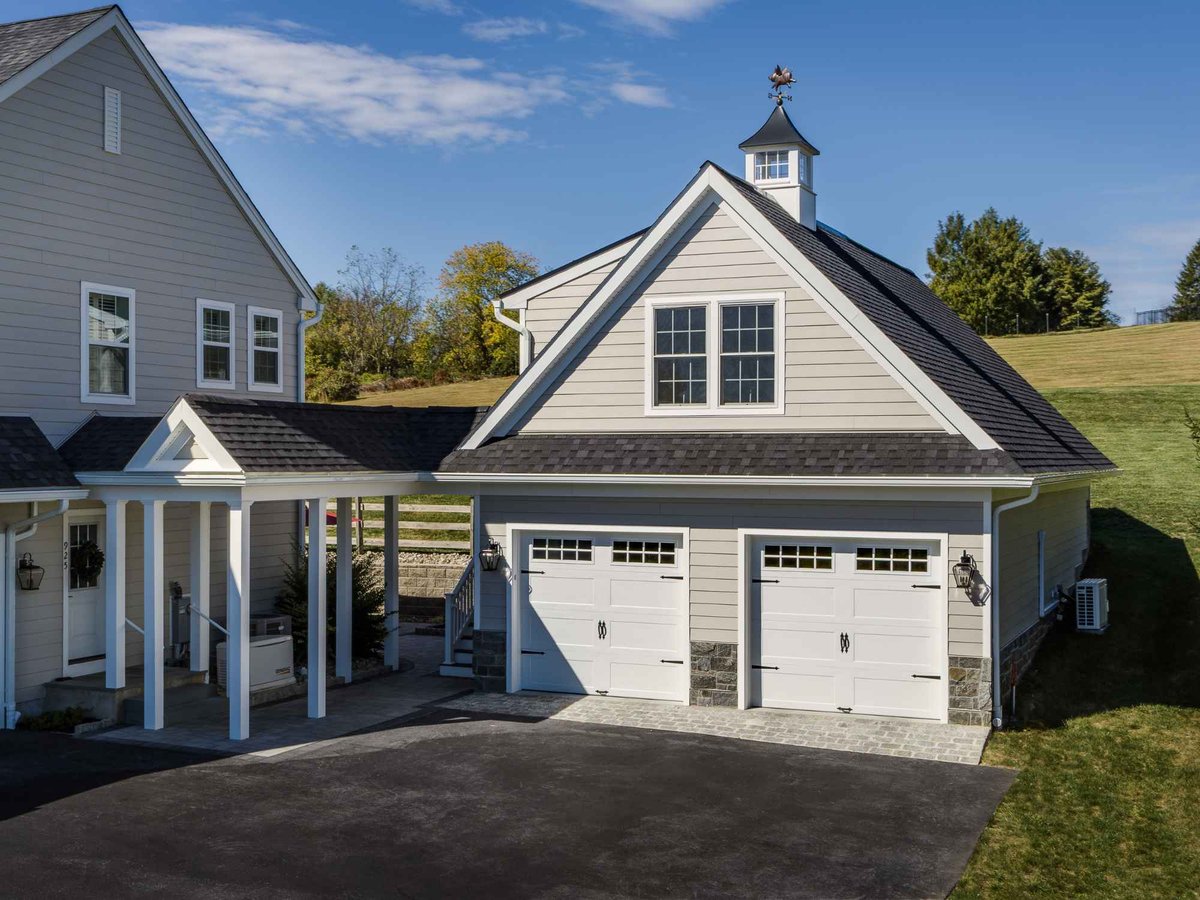 An image of a two-story garage addition built to match the homes design in West Chester by Thompson Communities