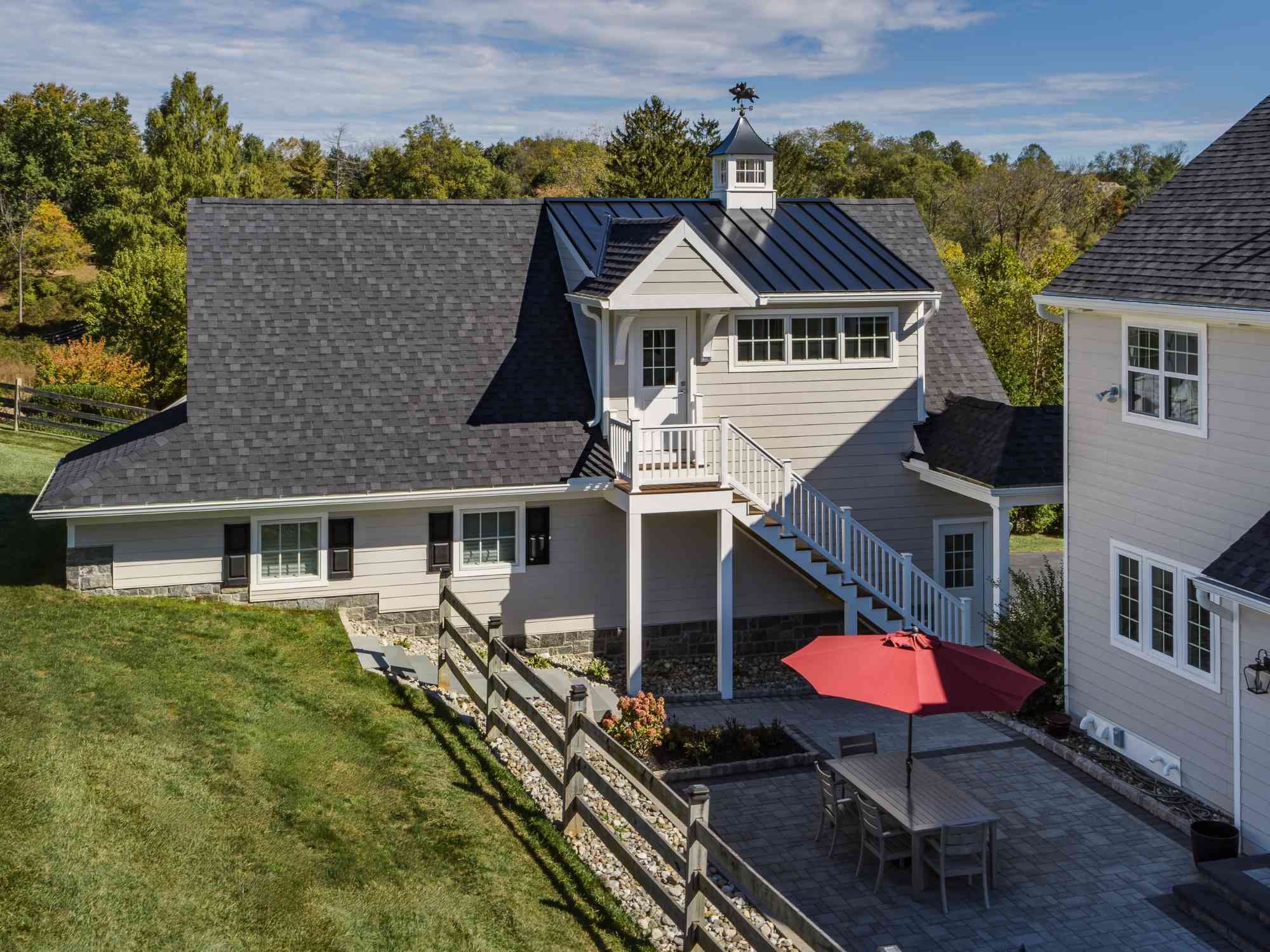 Image of the custom two-story garage with side access with stairs in West Chester, PA by Thompson Communities