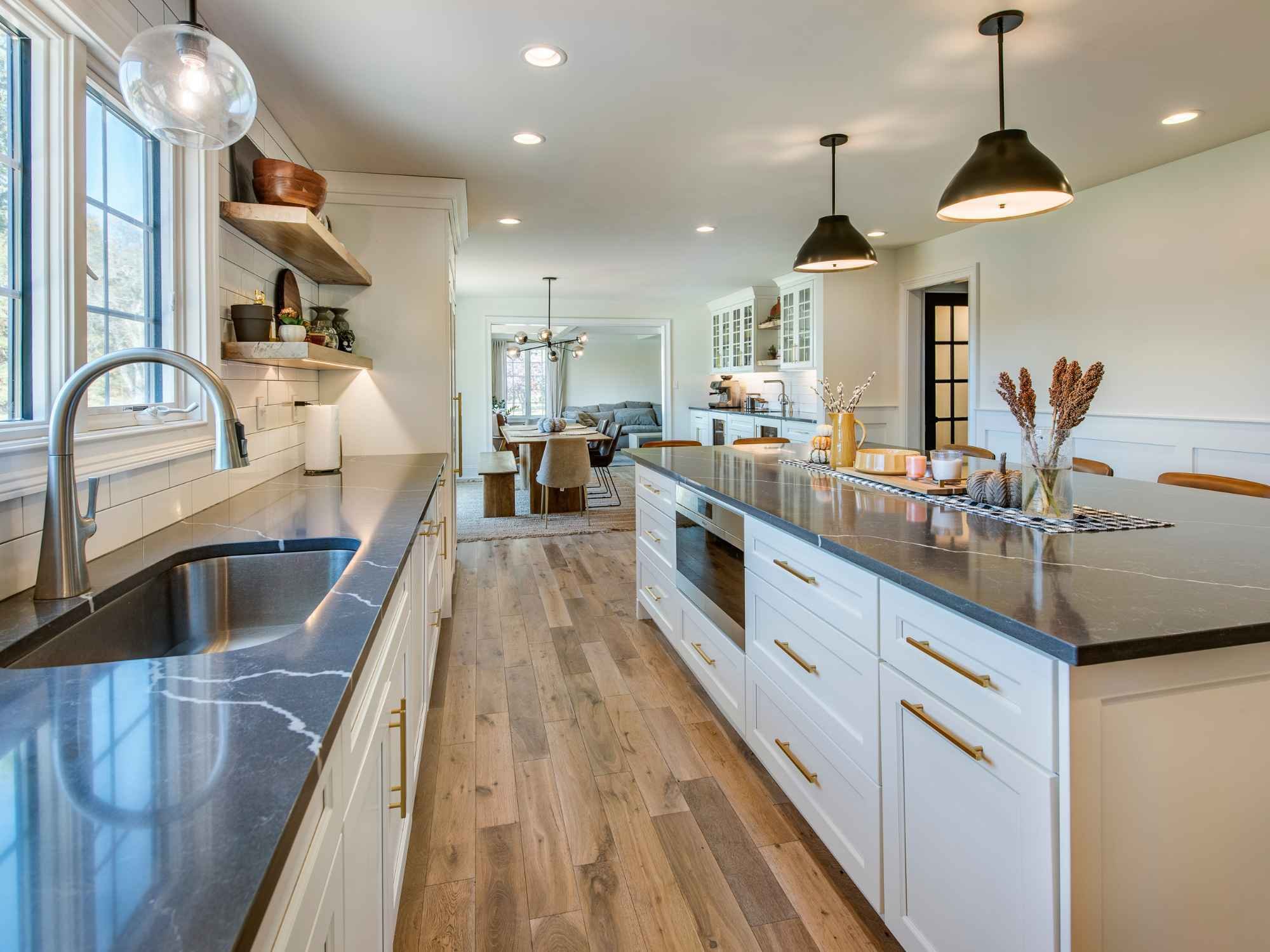 Open-concept custom kitchen remodel with large island and quartz countertops in West Chester, PA by Thompson Communities