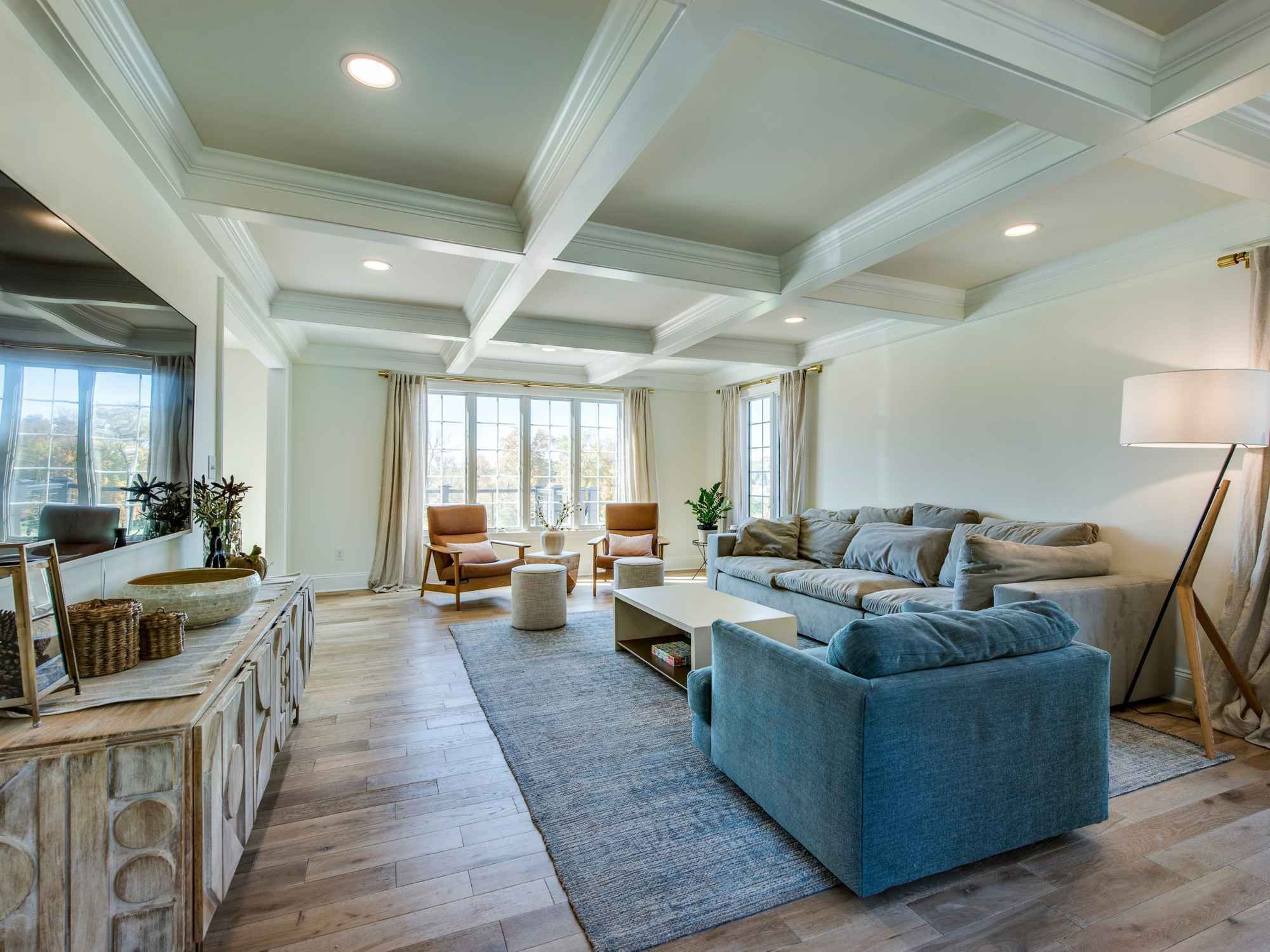 Open-concept family room with coffered ceiling in a whole home remodel by Thompson Communities, West Chester, PA Open-concept family room with coffered ceiling in a whole home remodel by Thompson Communities, West Chester, PA